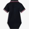 Kombinezon polo Tommy Wicking dla niemowląt Kombinezon polo Tommy Wicking dla niemowląt