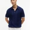 Sweter polo z krótkim rękawem i splotem warkoczowym Sweter polo z krótkim rękawem i splotem warkoczowym