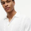 Sweter polo z krótkim rękawem i splotem warkoczowym