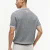 Sweter polo z krótkim rękawem i splotem warkoczowym Sweter polo z krótkim rękawem i splotem warkoczowym
